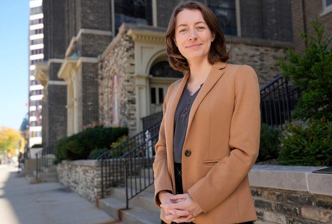 Milwaukee Journal Sentinel reporter Sophie Carson outside Old St. Mary at the corner of North Broadway and East Kilbourn Avenue in Milwaukee on Oct. 3.