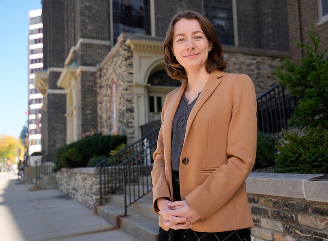 Milwaukee Journal Sentinel reporter Sophie Carson outside Old St. Mary at the corner of North Broadway and East Kilbourn Avenue in Milwaukee on Oct. 3.